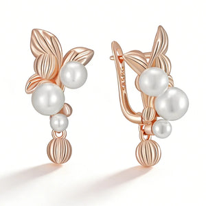 Rose gold leaf drop earrings with lustrous faux pearl accents and elegant dangling details for women.